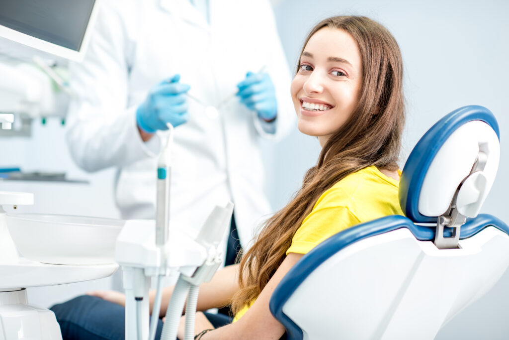 happy woman showing off the benefits of straight teeth